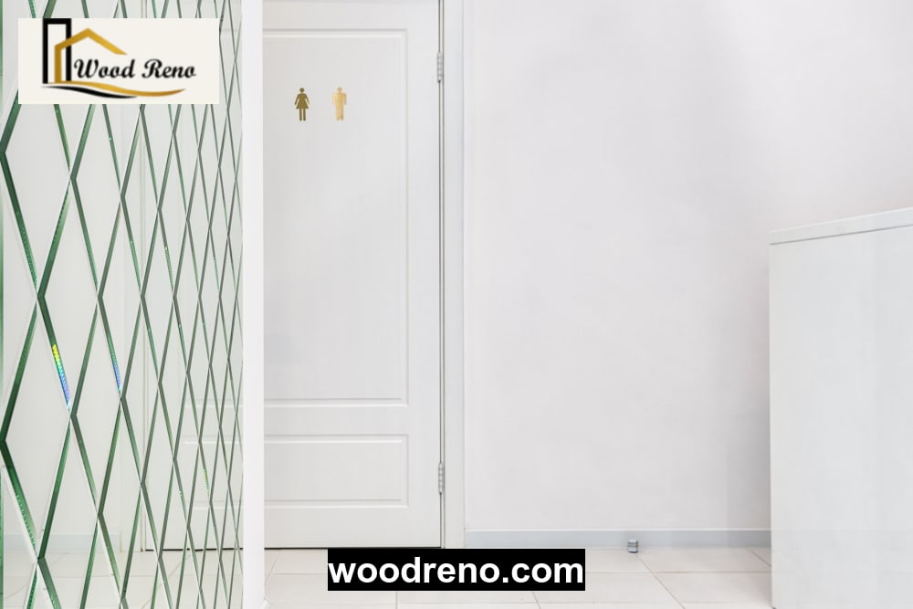 White interior door installed beside a tiled bathroom